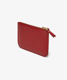 Red Outside Pocket U Wallet by Comme des Garçons Wallet, designed with a dual zippered closure and logo engraved in gold letters. Pocket Wallet, Gold Line, Gold Letters, Small Wallet, Comme Des Garcons, Wallets, The Outsiders, Wallet, Zipper