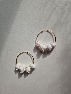 Minimalist floral KAIA hoop earrings beautifully will complete your bridal look. Made with hand-sculpted, softly textured clay flowers and attached onto 24k gold plated 45mm hoops. Inspired by peony blooms.  Light and easy to wear. Sent beautifully packaged in a Medze Bride gift box. As 'KIA' earrings are made to order especially for you as well due to hygienic reasons I cannot accept refunds/exchanges. But if you have any problems with your order please email me and I'll be happy to help you. Bride Hoop Earrings, Clay Bridal Earrings, Textured Clay, Jewellery Bridal, Floral Hoops, Bride Gift, Clay Flowers, Wedding Jewellery, Earrings White