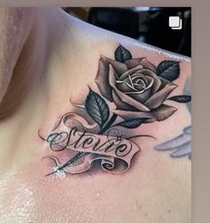 a woman's chest with a rose and the word love tattooed on her chest