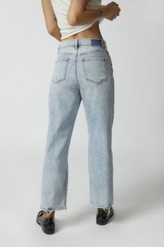 Get a classic lived-in look with these jeans from Daze Denim made using recycled materials. High-rise style with a relaxed fit from the waistband to the ankle-length hem. Finished with distressing throughout. Features Straight-leg Daze Denim jeans in a cropped silhouette Distressed Crafted from denim with a hint of stretch for comfort & fit Made with recycled materials Zip fly + 5-pocket styling Content + Care 60% Cotton, 33% recycled cotton, 5% polyester, 2% spandex Machine wash Imported Size +