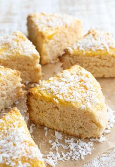 several pieces of cake with coconut sprinkled on top