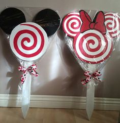 two lollipops shaped like mickey and minnie mouse ears