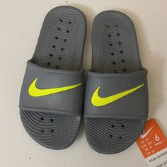 Nwt Nike Slides Gray Sandals Size 6 Yellow Sporty Non-slip Sandals, Gray Non-slip Slides For Summer, Sporty Non-slip Flip Flops With Round Toe, Non-slip Gray Slides For Summer, Sporty Non-slip Flip Flops, Gray Slides For Summer Beach, Gray Slides For Beach In Summer, Nike Non-slip Round Toe Sandals, Nike Non-slip Slip-on Sandals