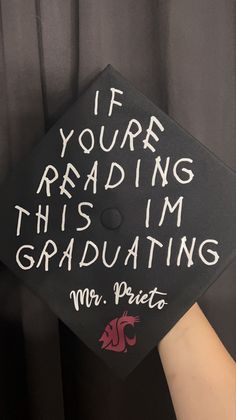 a graduation cap that says if you're reading this i'm graduating mr priest