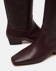 Introducing the GWYNETH square toe boot. These boots offer superior durability and style. Elevate your wardrobe with this versatile footwear option. Perfect for any occasion, the square-toe design provides both comfort and sophistication. 1.5 inch heel height Size 6 measurements: 14.5 inch shaft circumference, 15 inch shaft height Size 8 measurements: 15.5 inch shaft circumference, 15.5 inch shaft height Size 10 measurements: 16.5 inch shaft circumference, 16 inch shaft height Leather upper mate Brown Leather Knee High Boots, Dark Brown Boots, Summer Wardrobe Staples, Meg Ryan, Digital Fashion, Steve Madden Boots, Fashion Closet, Leather Wear, Tall Boot