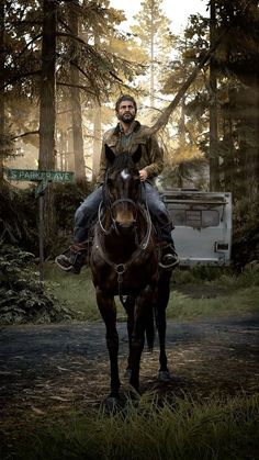 a man riding on the back of a brown horse next to a forest filled with trees