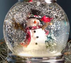 a snow globe with a snowman in it