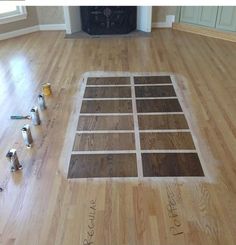 the floor is being laid out with different types of paint and tools on top of it