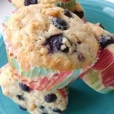 three blueberry muffins stacked on top of each other