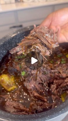 a person is cooking some meat in a pan on the stove top and it looks like they have been cooked