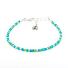 Dainty bracelet - green Blue Jewelry With Silver Beads For Summer, Blue Beaded Bracelets With Silver Beads For Beach, Blue Heishi Beads Bracelet With Tiny Beads, Blue Bracelets With Tiny Beads For Friendship, Summer Turquoise Beaded Bracelets, Blue Tiny Beads Beaded Bracelets For Beach, Adjustable Green Beads With Silver Accents, Green Bracelets With Colorful Beads For Beach, Blue Round Beads Bracelets For Summer