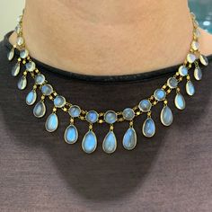 Glorious blue-tinted moonstones glow brightly in this antique gold necklace.  The finest moonstones are found in older jewels like this. Yet the quality within a piece is usually mixed, with some of the gemstones lacking in adularescence and/or that entrancing blast of blue.  This beautiful necklace has only the very best stones. The luminous teardrops delicately suspended from matched round stones resemble cascading, moonlit droplets of water. They were a delight to photograph.  It's the finest Edwardian Jewelry, Garnet Pendant, Blue Moonstone, Yellow Gold Setting, Moon Jewelry, Moonstone Necklace, Moonstone Pendant, Gold Set, Moon Stone