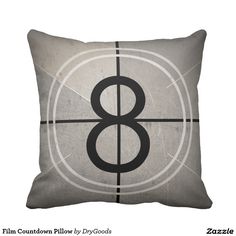 a square pillow with the number eight on it's front and side, in black and white