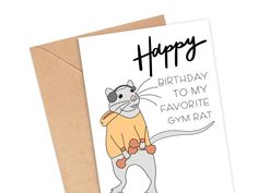 a birthday card with an image of a cat wearing a sweater and holding a mouse