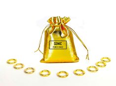 a gold bag with rings around it and the word sonic printed on it in black