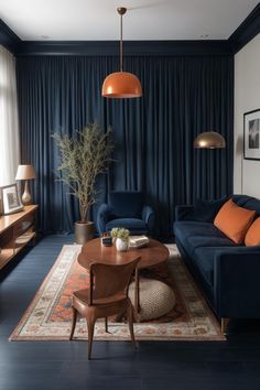 a living room filled with furniture and a large window covered in blue draping