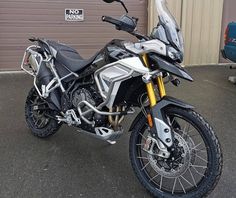 a motorcycle parked in front of a garage door