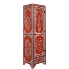 an ornately decorated cabinet with red and orange designs on the front, against a white background