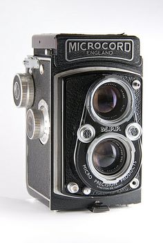 an old fashioned camera is shown on a white background