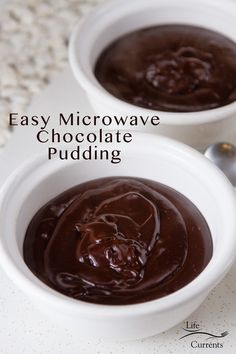 two white bowls filled with chocolate pudding