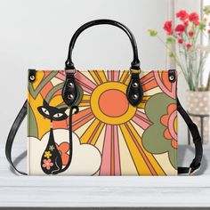 Holiday Shipping Deadlines: Handbags, travel bags, floor lamps, nesting tables, and wall switches: Order by December 5th. All other items: Order by December 10th.Be the cat's meow with our Atomic Cat Handbag! This Groovy Retro Mod Shoulder Bag combines Mid Century Modern Kitsch with a sunburst design for a GAL Purse unlike any other. With its quirky style and spacious design, you'll be turning heads everywhere you go. (Paws-ibly the coolest bag you'll ever own!) My handbag designs are truly uniq Trendy Shoulder Bag With Cat Design, Trendy Cat Print Shoulder Bag For Everyday Use, Trendy Travel Bags With Cat Print, Trendy Cat Print Travel Bag, Casual Multicolor Shoulder Bag With Cat Design, Trendy Cat Print Bag For Everyday Use, Daily Use Crossbody Bag With Cat Design, Trendy Cat Design Shoulder Bag For Shopping, Casual Multicolor Cat Design Shoulder Bag