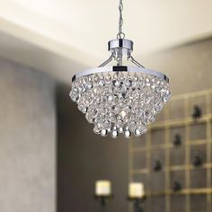 a chandelier hanging from the ceiling in a bathroom