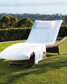 an outdoor chaise lounge in the grass