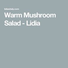 the words warm mushroom salad - lidia are in white on a gray background