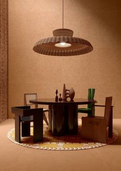 a dining room with a table, chair and lamp hanging from the ceiling over it