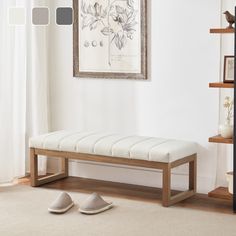 a wooden bench sitting on top of a carpeted floor