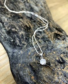 Our .925 Sterling Silver Cubic Zirconia necklace is as brilliant as the real thing!  Made with a .75 Carat brilliant cut CZ and .925 Sterling Silver components and chain.  Your choice of 16", 18", 20", 22" or 24" Sterling Silver Chain length.  Round CZ pendant is approximately 6mm in diameter. Dimensions are approximate and sizes or colors may vary slightly due to the characteristics of handmade products.  Please verify the correct shipping address before making your payment. If we ship your item to an old or invalid address and you are not able to locate the item, we are not responsible for shipping a replacement. Please review our Shop Policies page before purchasing: https://www.etsy.com/shop/BulletDesigns#policies Thanks! We appreciate you stopping by our shop! Dazzling Sterling Silver Diamond-cut Jewelry, Dazzling Diamond Cut Sterling Silver Jewelry, Silver Pendant Jewelry With Brilliant Cut, Diamond White Cubic Zirconia Solitaire Necklace For Anniversary, Dazzling Cubic Zirconia Solitaire Necklace With Prong Setting, Anniversary Solitaire Necklace In Diamond White Cubic Zirconia, Dazzling Solitaire Necklace With Prong Setting In Cubic Zirconia, Dazzling Sterling Silver Jewelry In Diamond White, Crystal Solitaire Necklace With Prong Setting As Gift