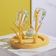 the toothbrush holder is made out of plastic and has three different types of toothbrushes in it