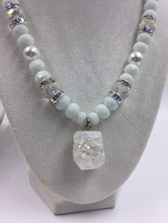 White and clear glass rondelle beaded necklace and silver tone spacers with crystals. White and clear druzy.  Great for any social event. Catch the eye of everyone in the room. This necklace makes the statement for you! Wear it with your favorite pair of jeans or dress it up for a day at the office.  Gift for her, wedding, bridesmaids gift, bachelorette party, wedding jewelry, church, First Sunday, Baptism. Measurements: Length - 18 inches White Crystal Necklace With Rhinestones, White Crystal Beaded Necklaces With Rhinestones, White Crystal Sparkling Necklaces, White Faceted Crystal Necklaces, White Faceted Crystal Necklace, White Crystal Necklace With Bling, White Crystal Bling Necklace, White Crystal Faceted Jewelry, White Faceted Crystal Jewelry