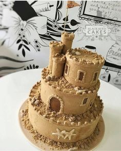 a sand castle cake on a white plate