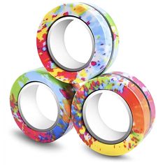 three rolls of colorful washi tape sitting on top of each other