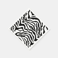 a black and white zebra print square paper napkin