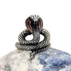 Cobra Snake Silver Ring, Stylish Eagle Statement Ring, Unisex Vintage Silver, Oxidized Silver Ring,Handmade Sterling Silver Ring,Animal Ring ✦ Details ✦ * Material: 925 Sterling Silver * Gemstone: Cubic zirconia * Weight: 9,00 grams * Sides oxidized  * Stamp: 925 * Available sizes; 5 US to 16 US. Contact me if you need any other size! ✦ Shipping ✦ * Processing time: 1-3 business days. * This item ships from my Turkish workshop in Istanbul. * Add your phone number in address box for a smoother de Cobra Snake, Oxidized Silver Rings, Animal Ring, Handmade Sterling Silver Rings, Animal Rings, Red Band, Silver Rings Handmade, Oxidized Silver, Handmade Sterling Silver