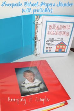 a red binder with a photo on it next to a blue binder that says keeping it simple