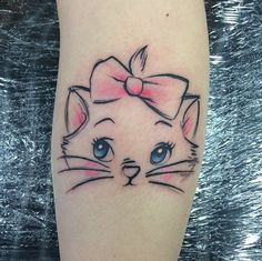 a cat with a bow on it's head is shown in this tattoo design