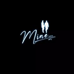 a neon sign that reads mine with two people standing next to it in the dark