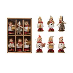 a bunch of small figurines in a wooden box