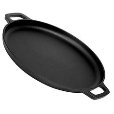 an empty cast iron skillet on a white background