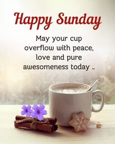 a cup of hot chocolate and cinnamon sticks on a table with the words happy sunday