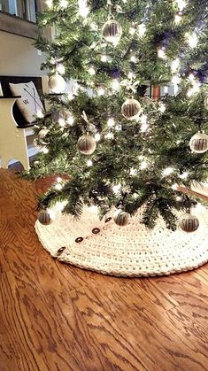 a small christmas tree with ornaments on it