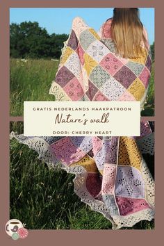 a woman is sitting in the grass with a blanket on her back and text overlay that reads, gratis nedeblands harkratoon nature's wall door