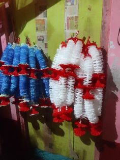 some red white and blue decorations hanging on a wall