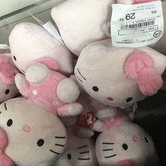 hello kitty stuffed animals are for sale in a store