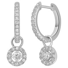 Make a stunning impression with these drop hoop earrings made with 14k white gold and genuine diamonds These lobe-hugging earrings have a lovely circular pattern that descends down and moves with the wearer. These snap-post earrings are studded with 0.33 carats of round full-cut and single-cut diamonds. Please follow the Luxury Jewels storefront to view the latest collections & exclusive one of a kind pieces. Luxury Jewels is proudly rated as a Top Seller on 1stDibs with all 5 star customer revi Fine Jewelry Dangle Hoop Earrings With Halo Design, Dangle Hoop Earrings With Halo Design In Cubic Zirconia, Diamond Brilliant Cut Dangle Hoop Earrings, Diamond Hoop Earrings With Brilliant Cut Dangle, White Gold Dangle Hoop Earrings With Brilliant Cut, White Gold Dangle Hoop Earrings For Anniversary, White Gold Diamond Huggie Earrings With Halo Design, Brilliant Cut White Gold Dangle Hoop Earrings, White Gold Halo Design Dangle Diamond Earrings