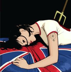 a woman laying on top of a bed covered in a british flag blanket