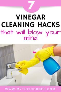 a person cleaning a sink with yellow gloves